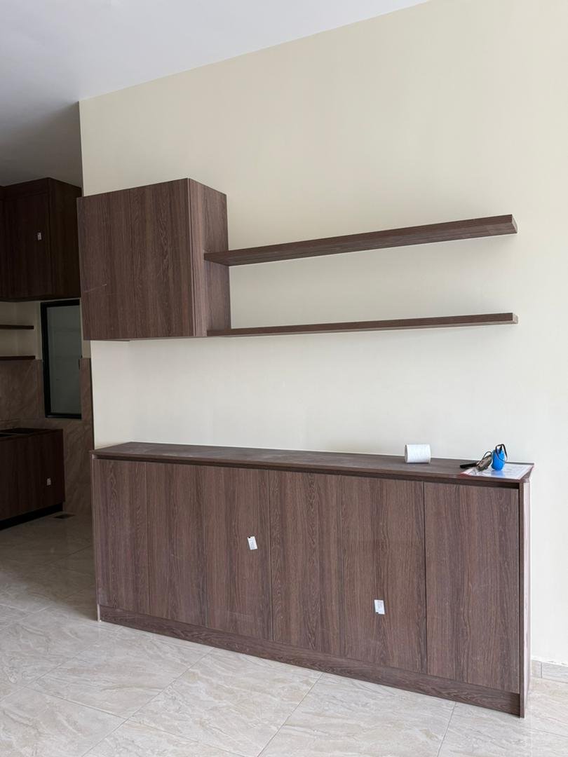 Full-height white gloss and oak kitchen pantry unit with open display niche