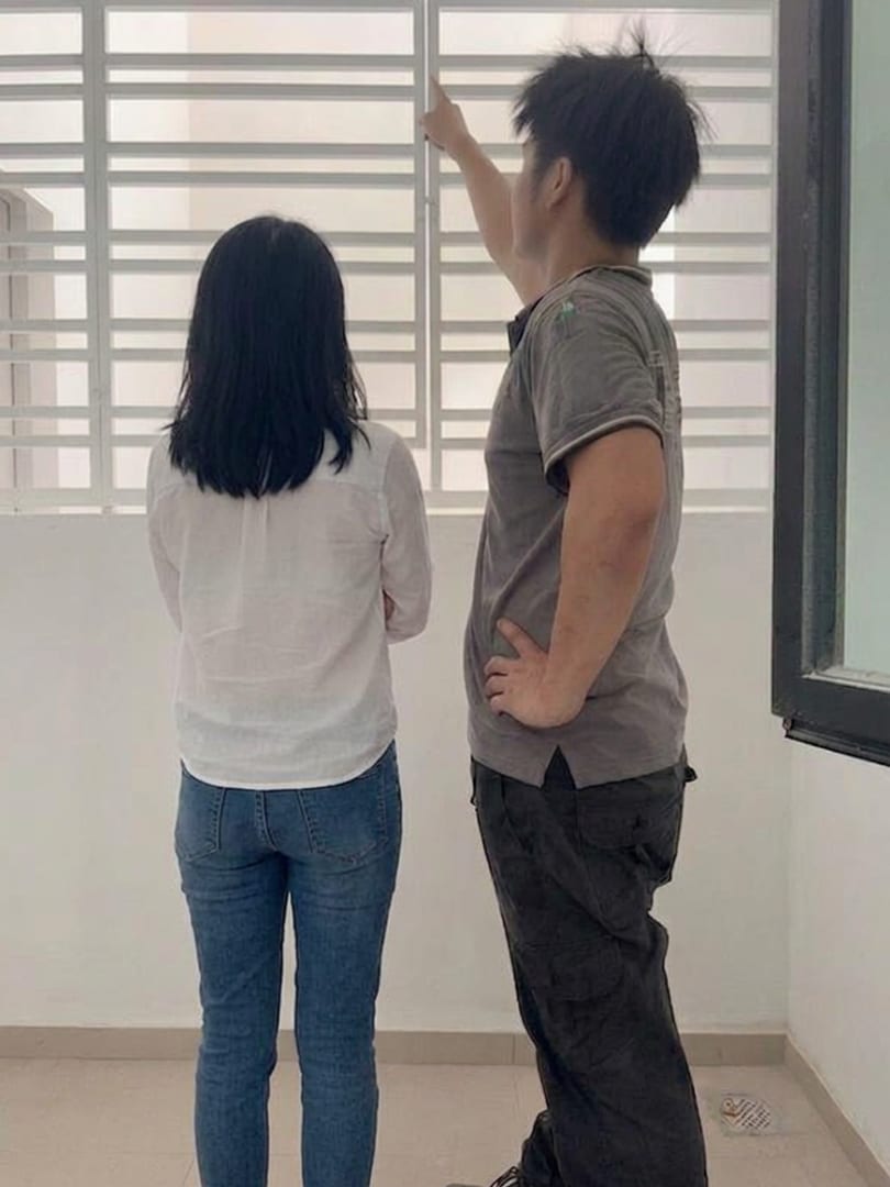 Tenn team member showing a homeowner the finished window grille at handover