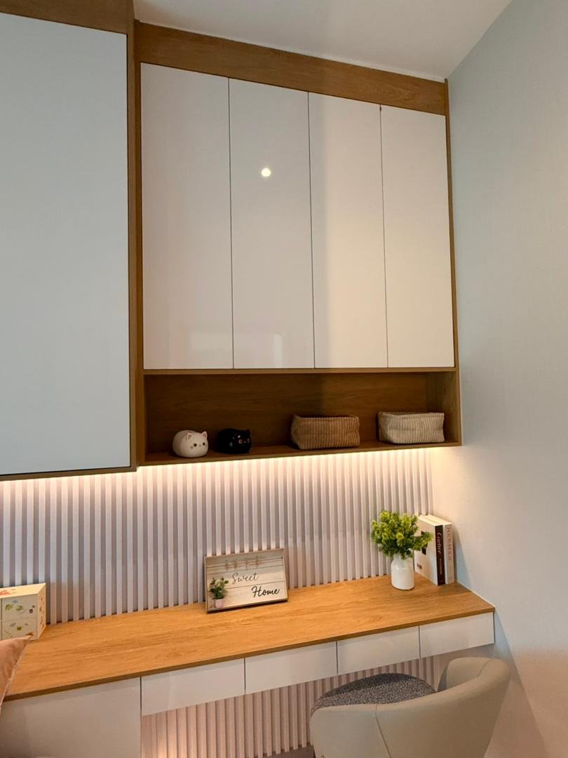 Close view of the study desk, fluted wall panel and overhead cabinets in the children's room, Klebang showroom