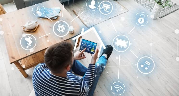 Person controlling a connected smart home from a tablet